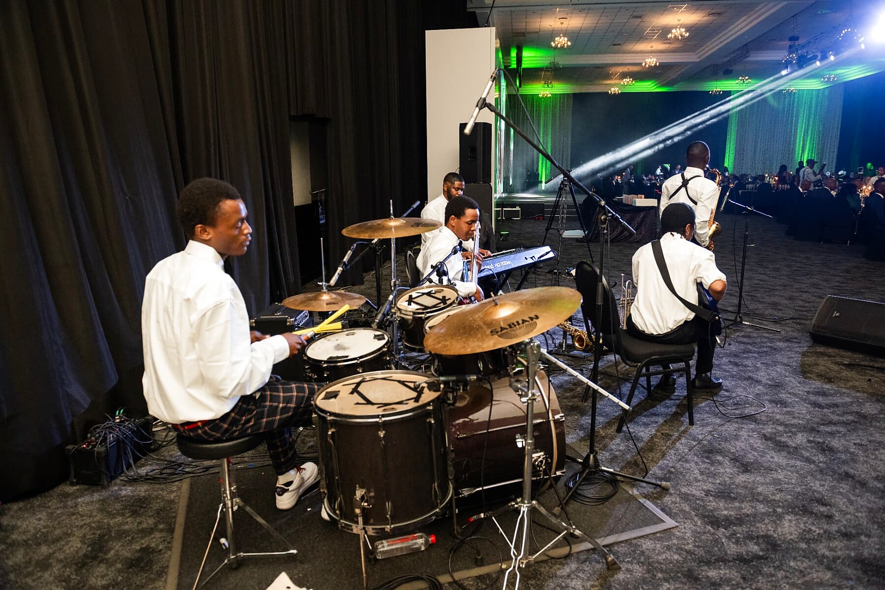 The live band performing from the side of the stage at the SANAA 2026 gala