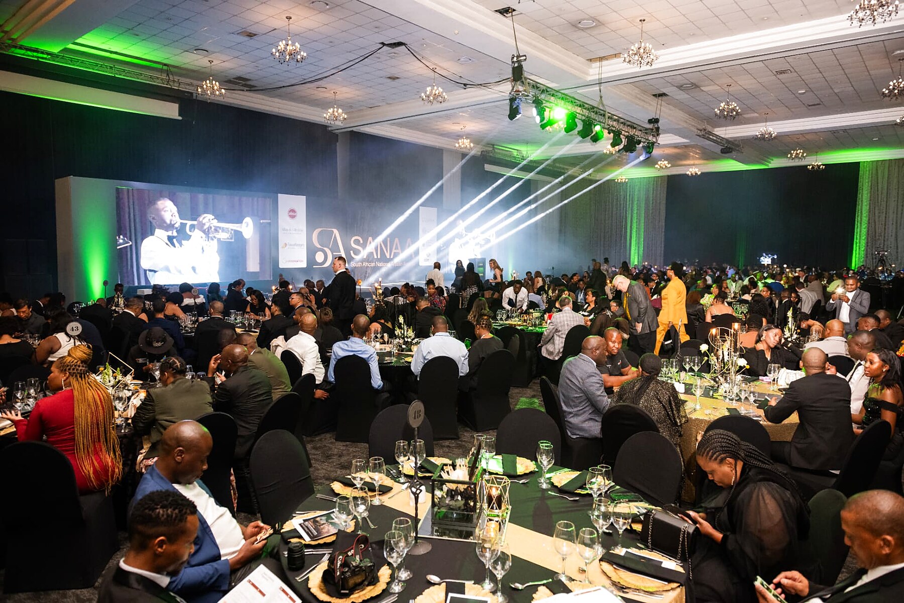 Packed SANAA 2026 gala ballroom with the trumpet performance on the big screen