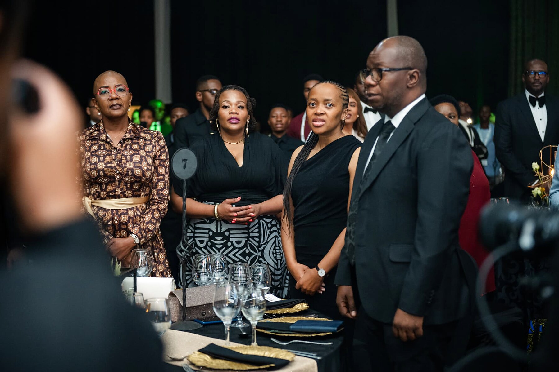 Delegates standing for the national anthem at the SANAA 2026 gala