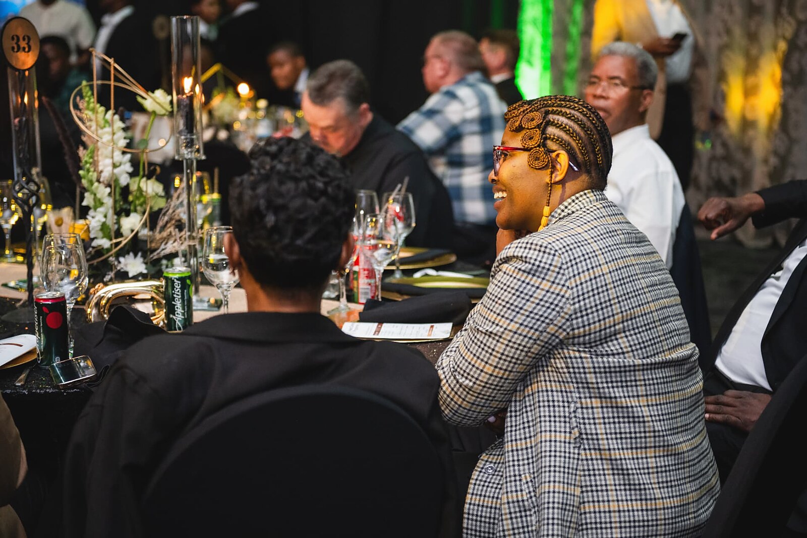 Guest sharing a laugh with fellow delegates at table 33