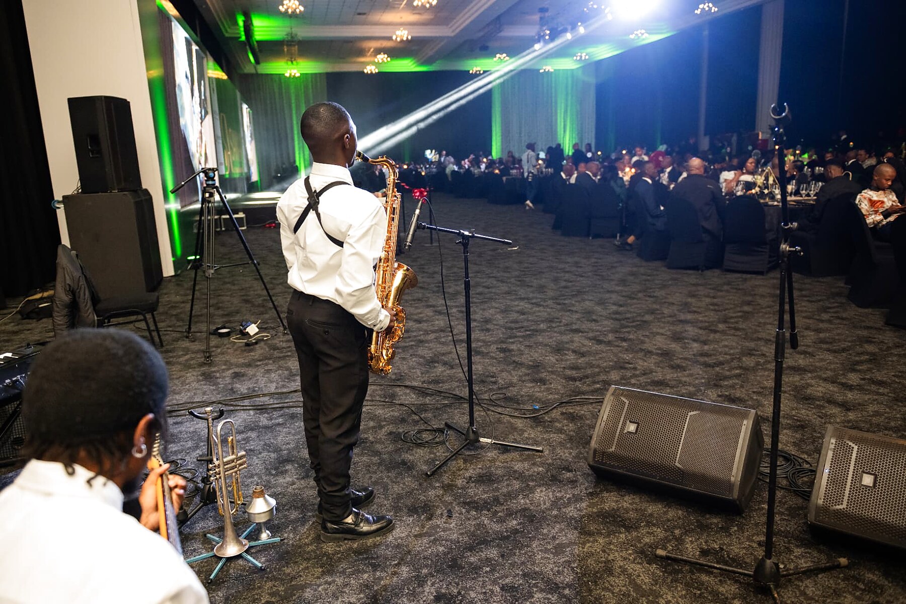 Saxophonist performing for the seated audience at the SANAA 2026 gala