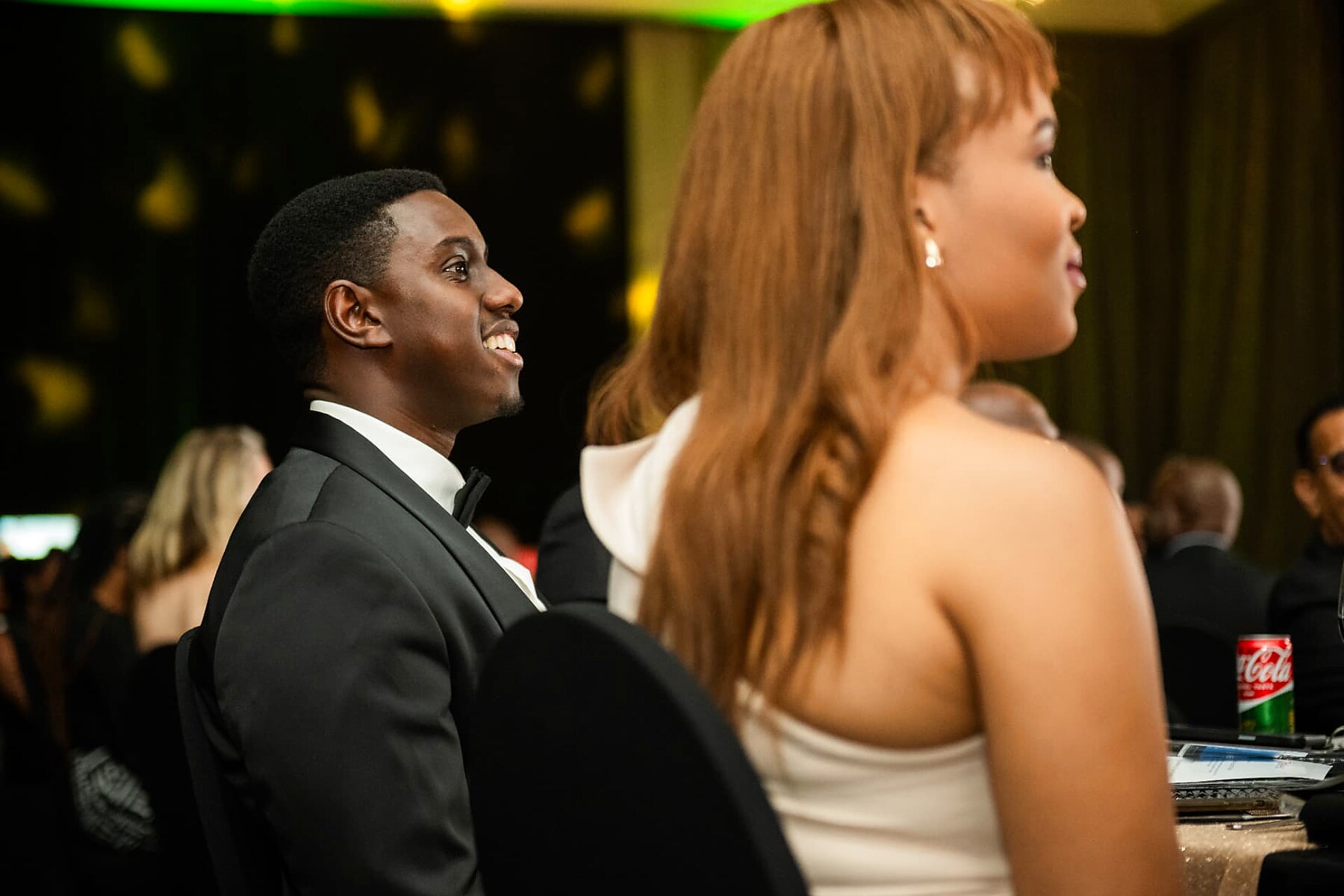 A couple watching the SANAA 2026 awards presentation from their table