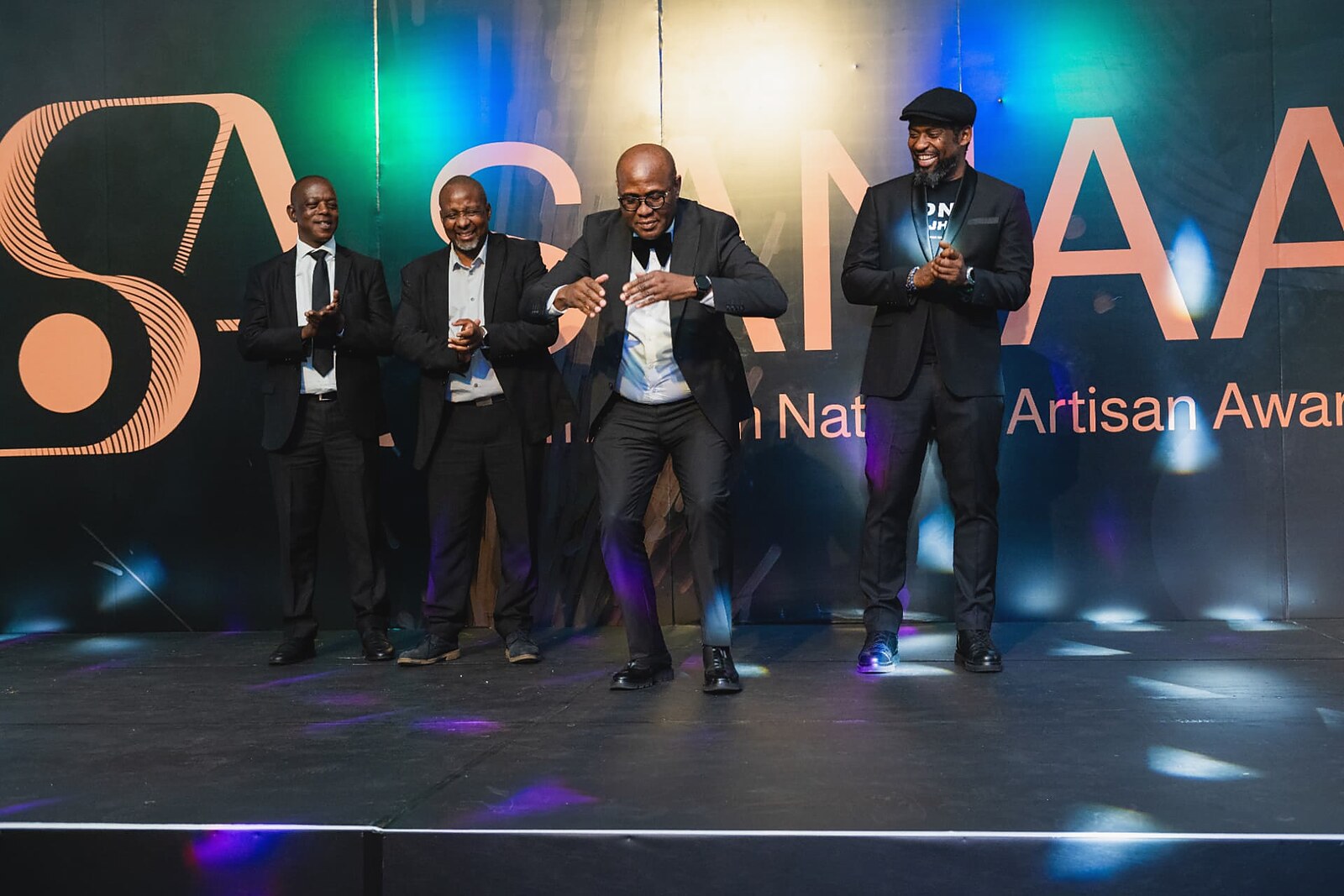 Dignitaries dancing on stage during the celebration