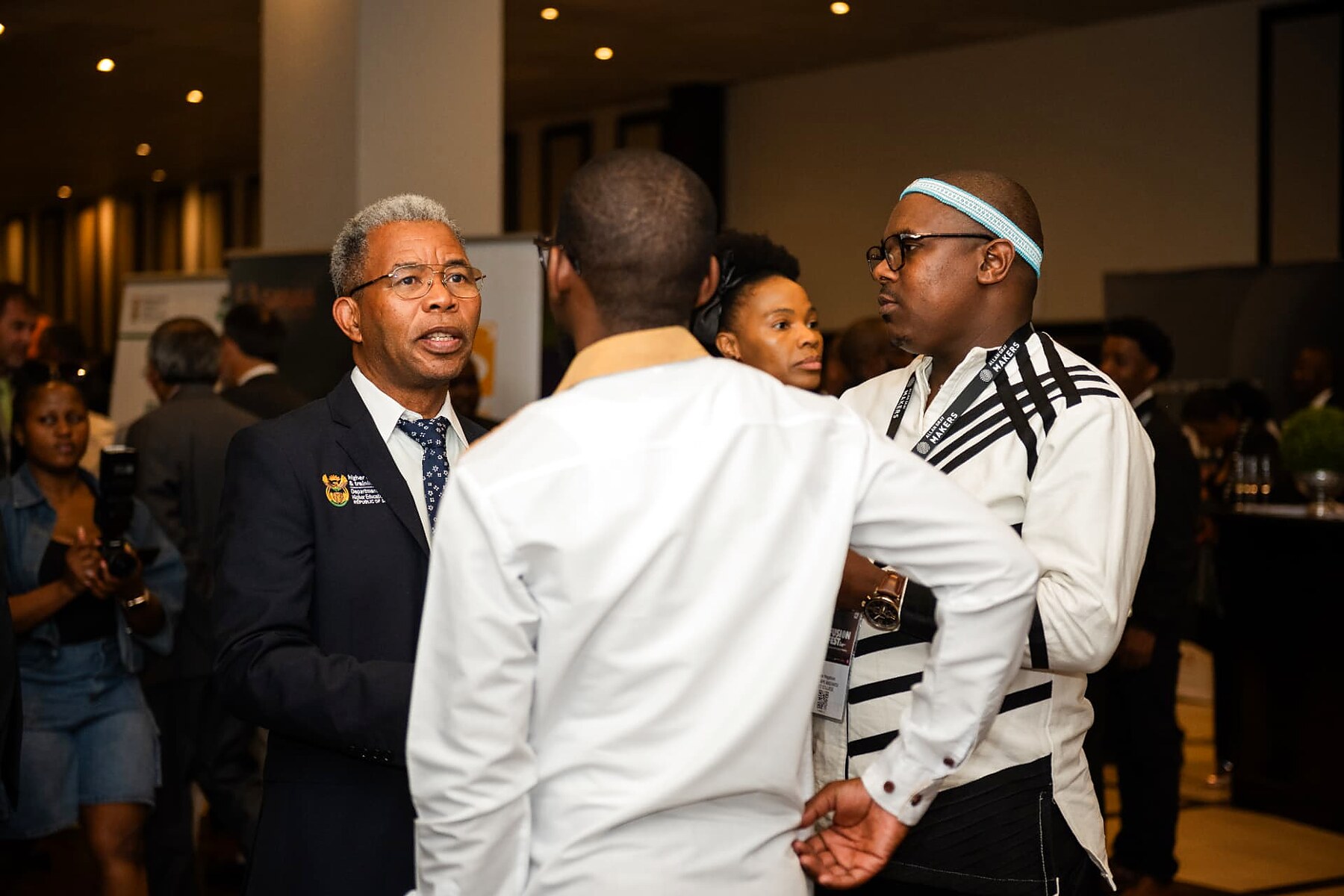 DHET official in conversation with artisans during the SANAA 2026 reception
