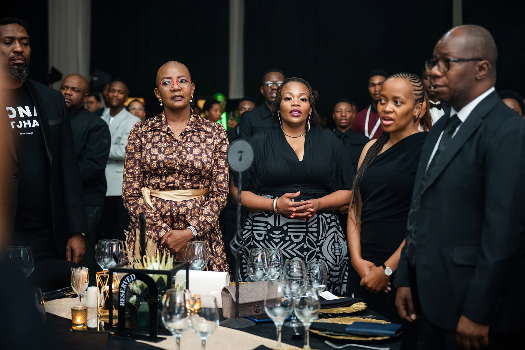 Guests standing at their table during the opening of the SANAA 2026 gala