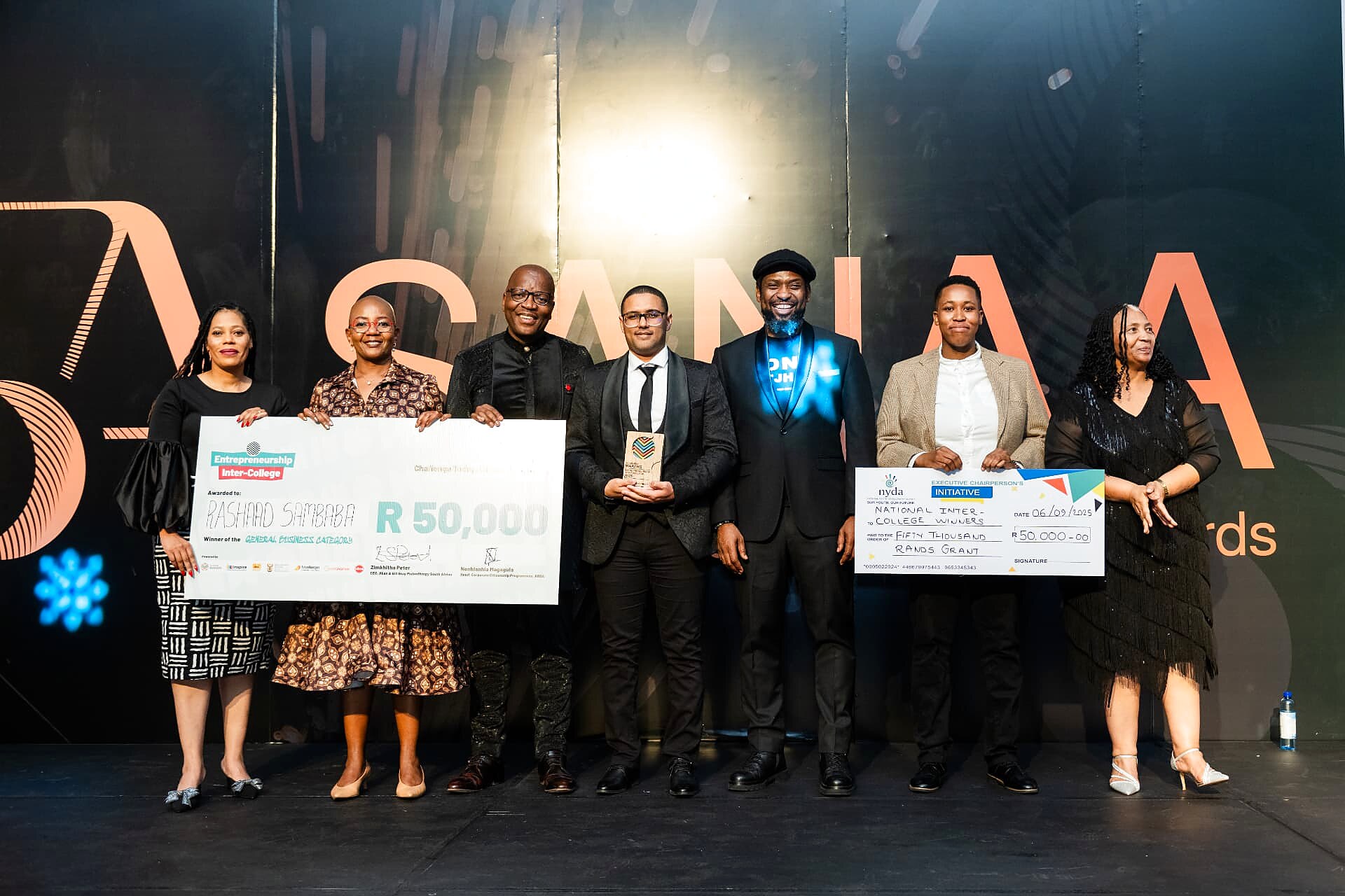 General business category winner Rashaad Sambaba with a R50,000 cheque and trophy alongside dignitaries